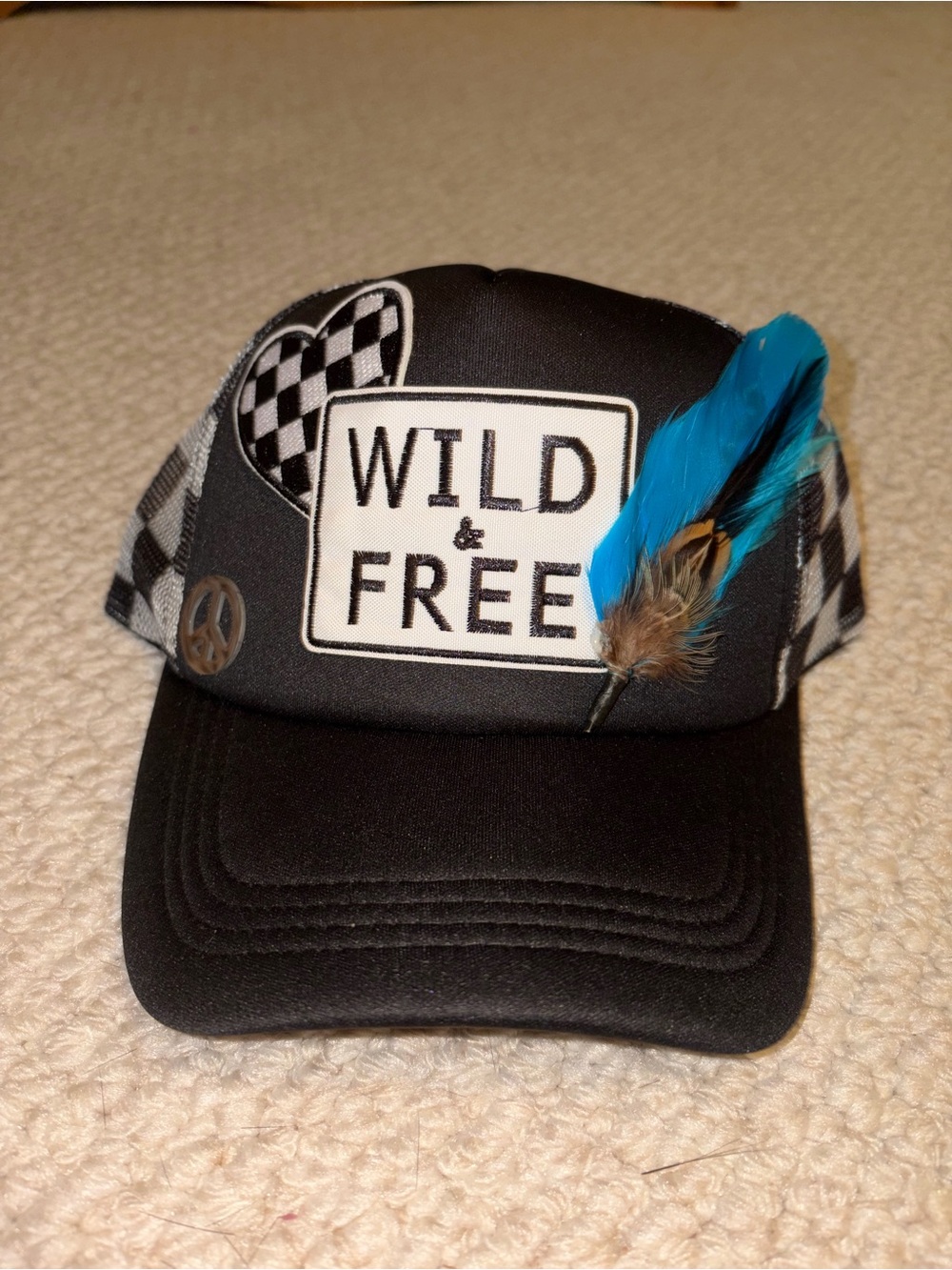 Wild & Free Black women's Trucker Hat with Blue Feather